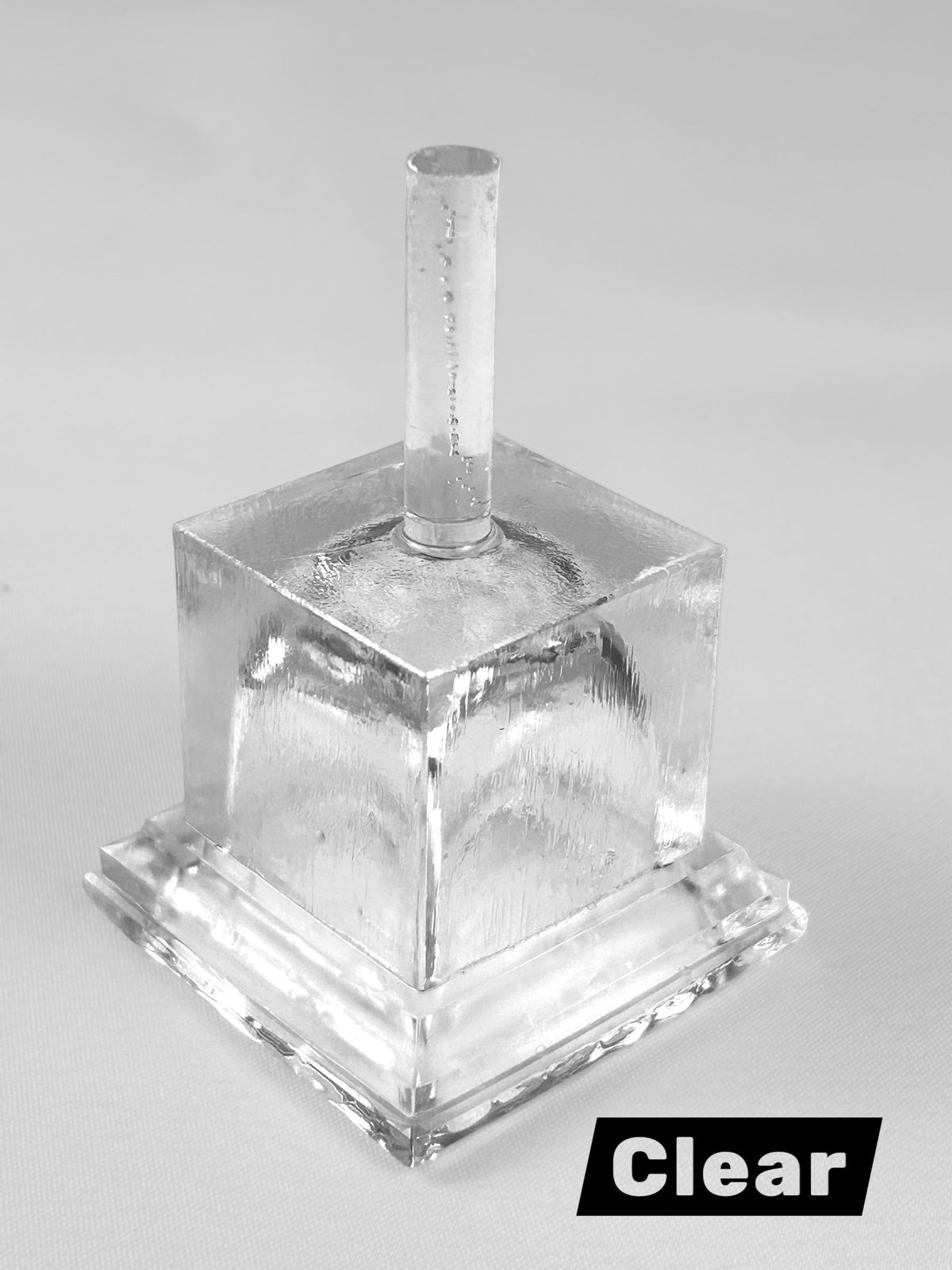 Printed clear cube with a post on top made with clear resin